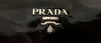 Лаковый клатч Prada