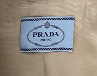 Бежевое пальто Prada