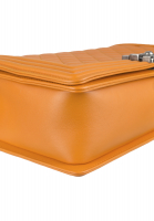 Стеганая оранжевая сумка Chanel Boy